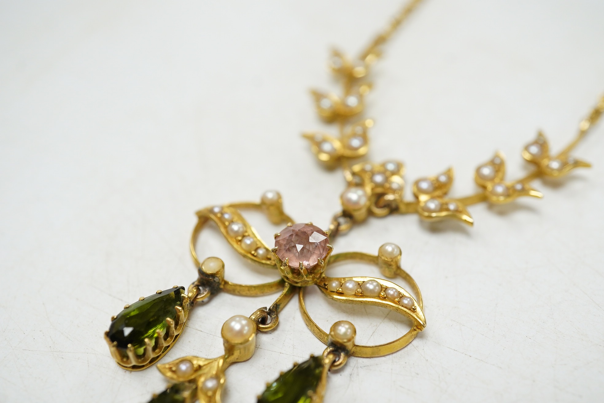 An early 20th century yellow metal and gem cluster set drop pendant necklace, 45cm, gross weight 12.7 grams. Condition - fair to good